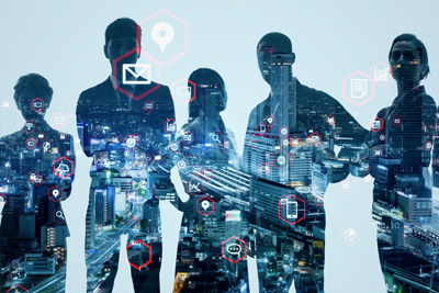 silhouettes of five professionals against a cityscape with digital icons representing communication and technology