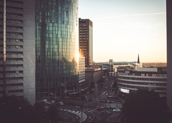 city skyline at sunset with modern buildings and traffic on the streets urban landscape